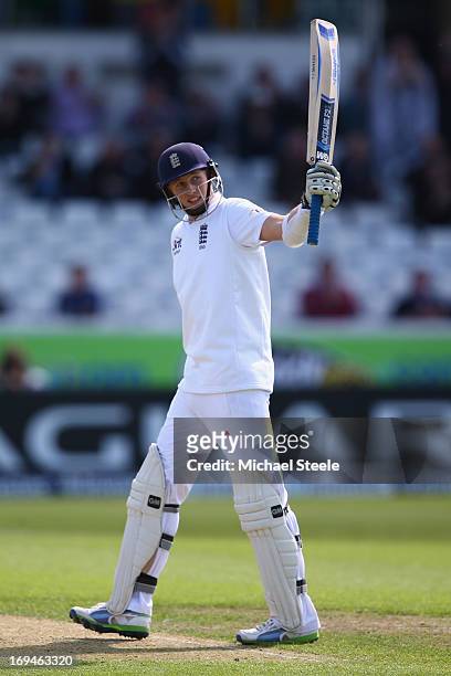 Joe Root of England raises his bat to the applause after reaching his fifty during day two of the 2nd Investec Test match between England and New...