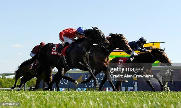 Shane Kelly riding Kingsgate Native win The Betfred Temple Stakes at Haydock racecourse on May 25, 2013 in Haydock, England.