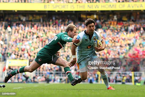 Ben Foden of Northampton goes past Mathew Tait of Leicester to score his team's second try during the Aviva Premiership Final between Leicester...
