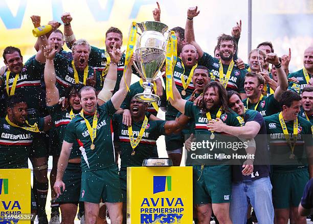 Geordan Murphy and Martin Castrogiovanni of Leicester lift the trophy following their team's 37 - 17 victory during the Aviva Premiership Final...