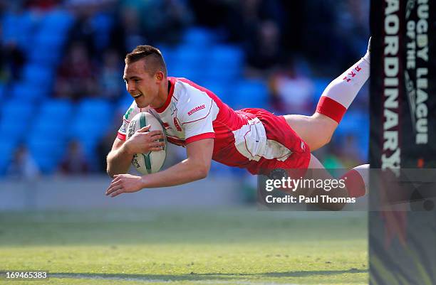 Greg Eden of Hull KR dives into score a try during the Super League Magic Weekend match between Hull FC and Hull Kingston Rovers at the Etihad...