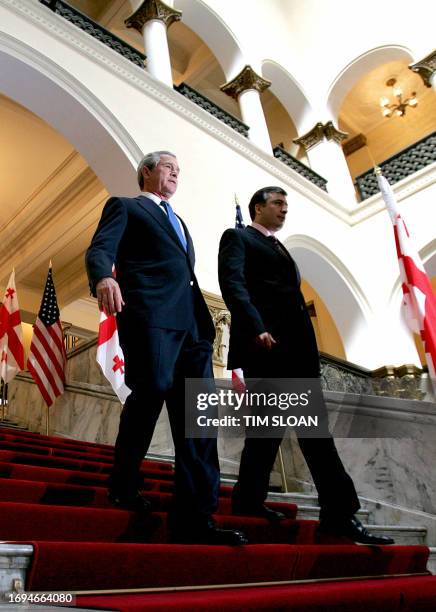 President George W. Bush walks with his Georgian counterpart Mikhail Saakashvili 10 May 2005 to a press conference in the parliament in Tbilisi. AFP...