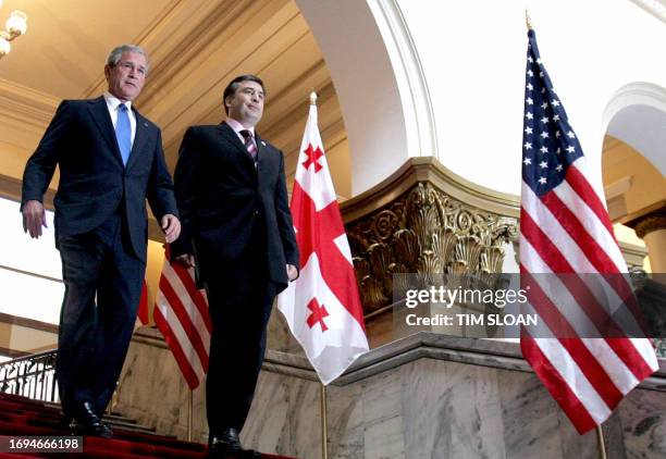 President George W. Bush walks with his Georgian counterpart Mikhail Saakashvili 10 May 2005 to a press conference in the parliament in Tbilisi. AFP...