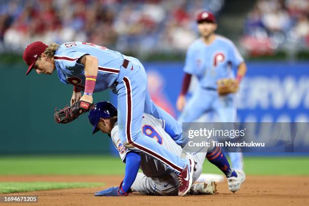 Bryson Stott of the Philadelphia Phillies and Brandon Nimmo of the New York Mets collide during the seventh inning at Citizens Bank Park on September...