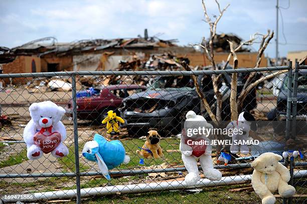 Toys and crosses adorn a makeshift memorial on the grounds of the Plaza Towers elementary school in memory of the seven children who died during the...