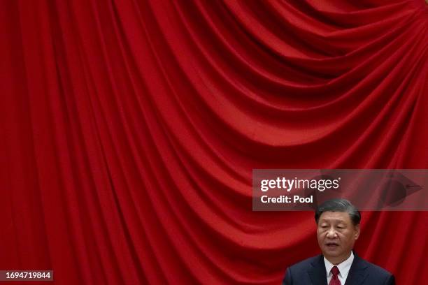 Chinese President Xi Jinping delivers his speech at a dinner marking the 74th anniversary of the founding of the People's Republic of China at the...