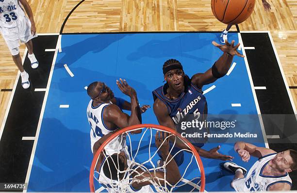 Kwame Brown of the Washington Wizards puts up a shot during the NBA game against the Orlando Magic at TD Waterhouse Centre on December 6, 2002 in...