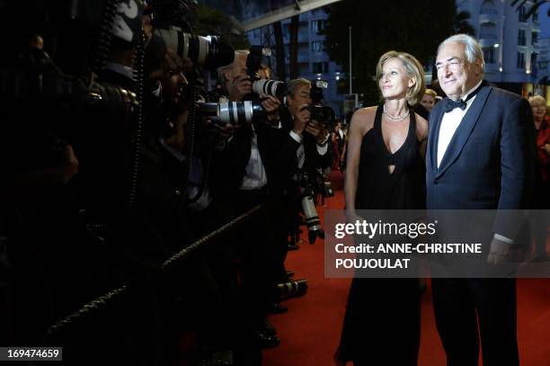 Ex-IMF chief Dominique Strauss-Kahn poses on May 25, 2013 with Media Marketing Executive Myriam L'Aouffir as they arrive to attend the screening of...