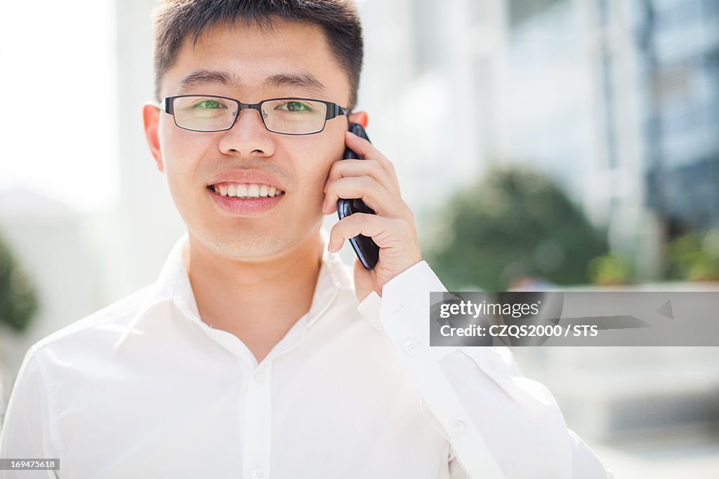 Businessman calling by mobile phone