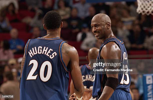 Michael Jordan and Larry Hughes of the Washington Wizards talk during the NBA game against the Orlando Magic at TD Waterhouse Centre on December 6,...