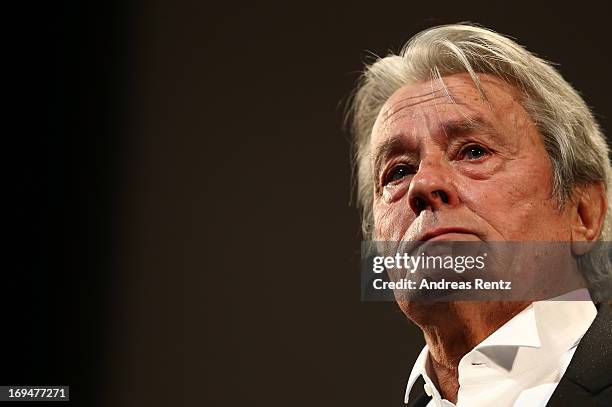 French-Swiss actor Alain Delon appears on stage during a Tribute To Alain Delon at Theatre Lumiere during The 66th Annual Cannes Film Festival at the...