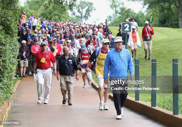 Kenny Perry walks ahead of a group as he crosses the second hole bridge during Round Three of the Senior PGA Championship presented by KitchenAid at...