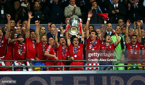 Captain Philipp Lahm of Bayern Muenchen lifts the trophy after winning the UEFA Champions League final match against Borussia Dortmund at Wembley...