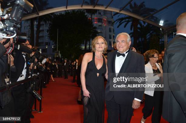 Ex-IMF chief Dominique Strauss-Kahn and Media Marketing Executive Myriam L'Aouffir pose on May 25, 2013 as they arrive for the screening of the film...