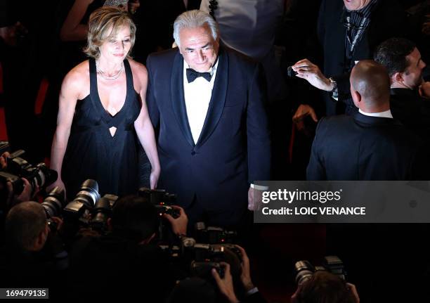 Ex-IMF chief Dominique Strauss-Kahn and Media Marketing Executive Myriam L'Aouffir pose on May 25, 2013 as they arrive for the screening of the film...