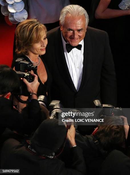 Ex-IMF chief Dominique Strauss-Kahn and Media Marketing Executive Myriam L'Aouffir pose on May 25, 2013 as they arrive for the screening of the film...