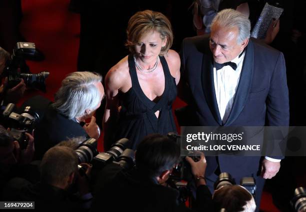 Ex-IMF chief Dominique Strauss-Kahn and Media Marketing Executive Myriam L'Aouffir pose on May 25, 2013 as they arrive for the screening of the film...