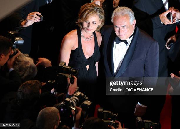 Ex-IMF chief Dominique Strauss-Kahn and Media Marketing Executive Myriam L'Aouffir pose on May 25, 2013 as they arrive for the screening of the film...