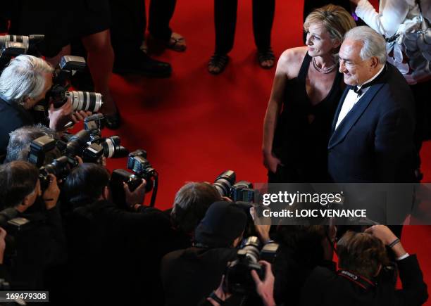 Ex-IMF chief Dominique Strauss-Kahn and Media Marketing Executive Myriam L'Aouffir pose on May 25, 2013 as they arrive for the screening of the film...
