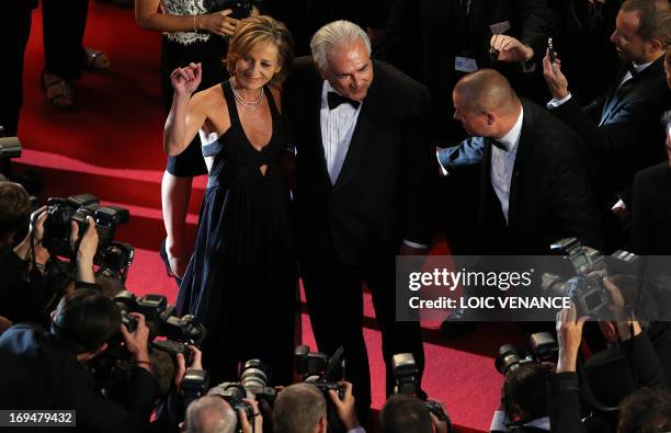 Ex-IMF chief Dominique Strauss-Kahn and Media Marketing Executive Myriam L'Aouffir pose on May 25, 2013 as they arrive for the screening of the film...