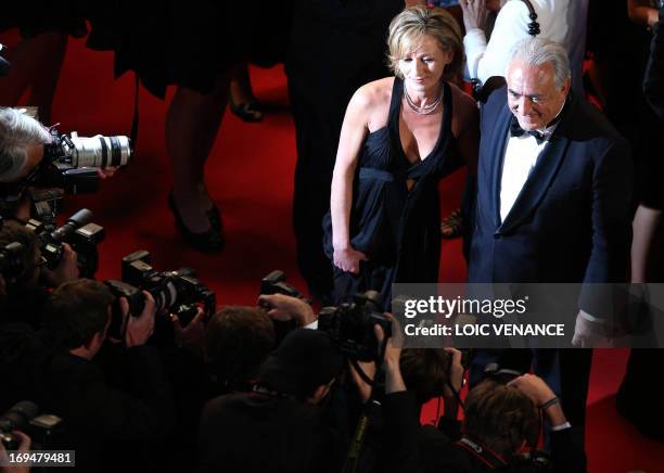 Ex-IMF chief Dominique Strauss-Kahn and Media Marketing Executive Myriam L'Aouffir pose on May 25, 2013 as they arrive for the screening of the film...