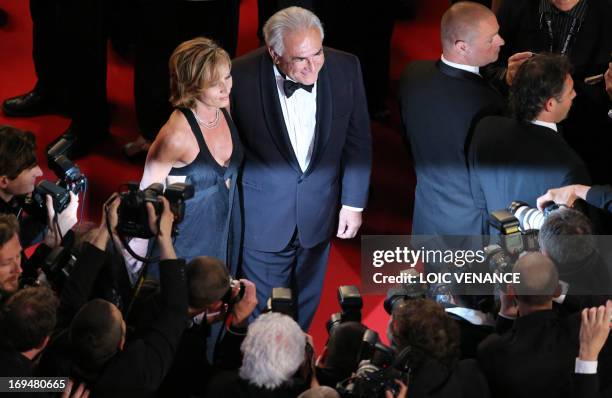 Ex-IMF chief Dominique Strauss-Kahn and Media Marketing Executive Myriam L'Aouffir pose on May 25, 2013 as they arrive for the screening of the film...
