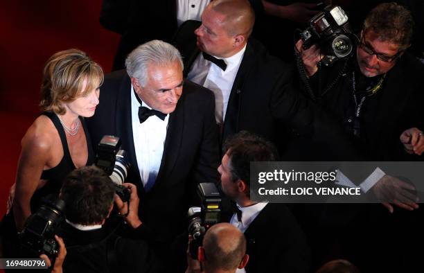 Ex-IMF chief Dominique Strauss-Kahn and Media Marketing Executive Myriam L'Aouffir pose on May 25, 2013 as they arrive for the screening of the film...