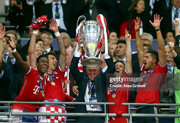 Head Coach Jupp Heynckes of Bayern Muenchen lifts the trophy after winning the UEFA Champions League final match against Borussia Dortmund at Wembley...