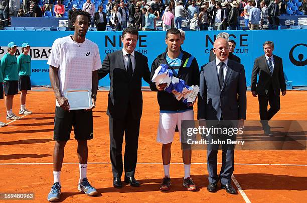 Gael Monfils of France, Christian Estrosi, Mayor of Nice, Albert Montanes of Spain holding the trophy and congressman Eric Ciotti pose during the...