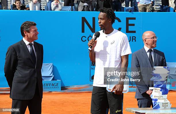 Gael Monfils of France says few words in front of Christian Estrosi, Mayor of Nice and congressman Eric Ciotti during the trophy ceremony after...