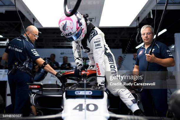 Liam Lawson of New Zealand and Scuderia AlphaTauri prepares to drive in the garage during practice ahead of the F1 Grand Prix of Japan at Suzuka...