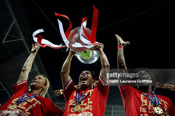 Claudio Pizarro of Bayern Muenchen holds the trophy after winning the UEFA Champions League final match against Borussia Dortmund at Wembley Stadium...