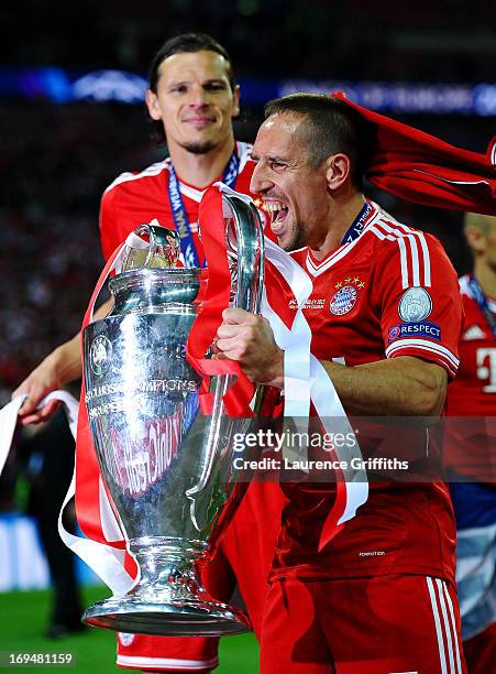 Franck Ribery of Bayern Muenchen holds the trophy after winning the UEFA Champions League final match against Borussia Dortmund at Wembley Stadium on...