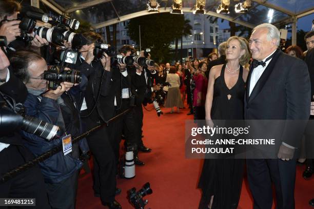 Ex-IMF chief Dominique Strauss-Kahn and Media Marketing Executive Myriam L'Aouffir arrive on May 25, 2013 for the screening of the film "Only Lovers...
