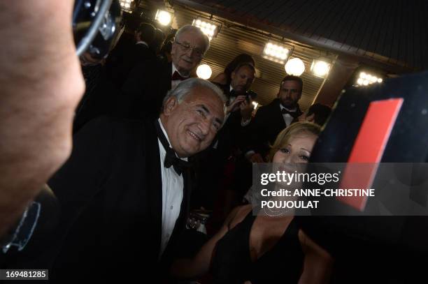 Ex-IMF chief Dominique Strauss-Kahn and Media Marketing Executive Myriam L'Aouffir arrive on May 25, 2013 for the screening of the film "Only Lovers...