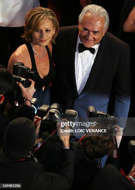 Ex-IMF chief Dominique Strauss-Kahn and Media Marketing Executive Myriam L'Aouffir arrive on May 25, 2013 for the screening of the film "Only Lovers...