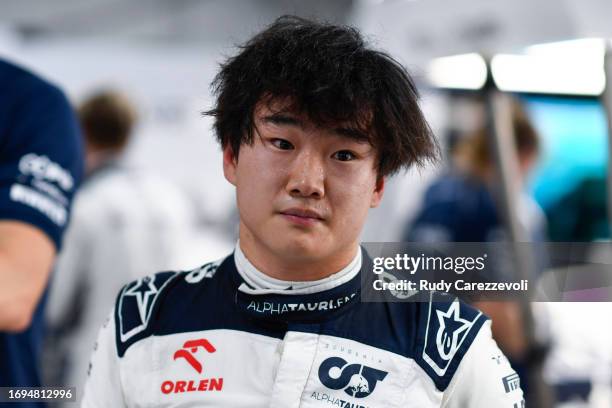 Yuki Tsunoda of Japan and Scuderia AlphaTauri prepares to drive in the garage during practice ahead of the F1 Grand Prix of Japan at Suzuka...