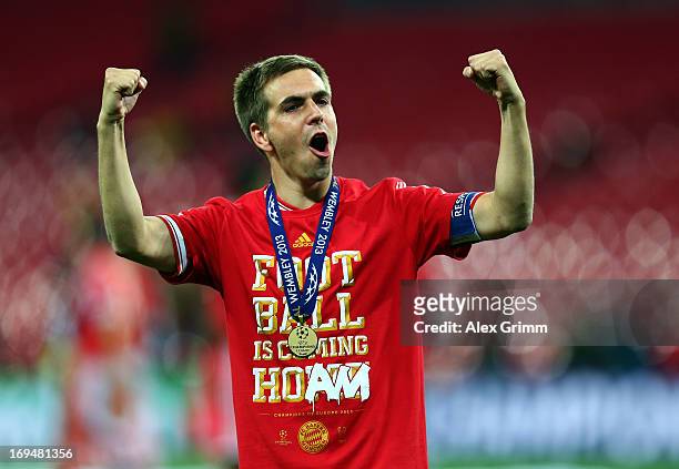 Philipp Lahm of Bayern Muenchen celebrates after winning the UEFA Champions League final match against Borussia Dortmund at Wembley Stadium on May...