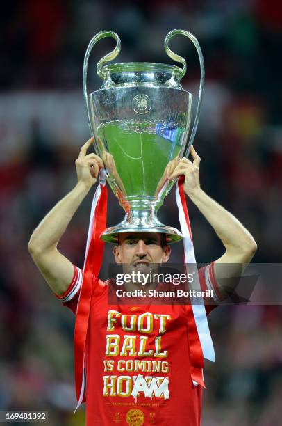 Franck Ribery of Bayern Muenchen holds the trophy after winning the UEFA Champions League final match against Borussia Dortmund at Wembley Stadium on...