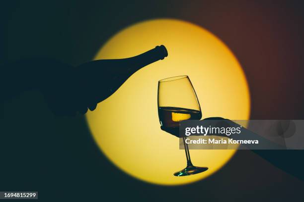 wine being poured in to a wine glass. - color enhanced stock pictures, royalty-free photos & images