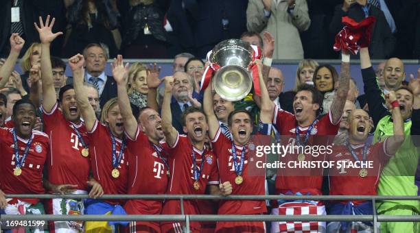 Bayern Munich's German defender Philipp Lahm lifts the trophy after the UEFA Champions League final football match between Borussia Dortmund and...