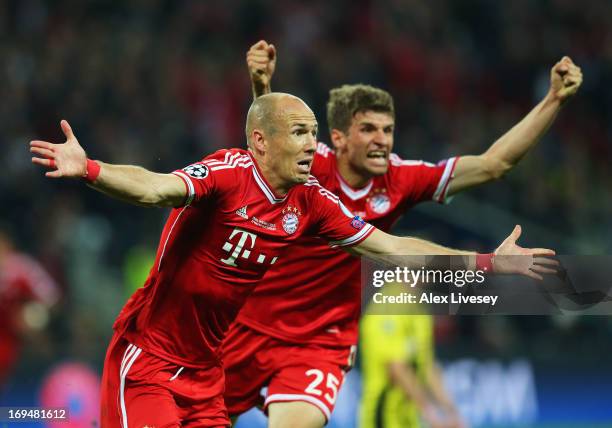 Arjen Robben of Bayern Muenchen celebrates with team-mate Thomas Mueller after scoring a goal during the UEFA Champions League final match between...