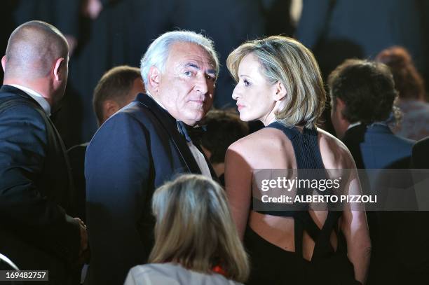 Ex-IMF chief Dominique Strauss-Kahn and Media Marketing Executive Myriam L'Aouffir pose on May 25, 2013 as they arrive for the screening of the film...