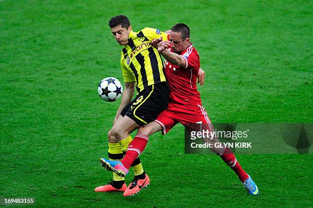 Borussia Dortmund's Polish striker Robert Lewandowski vies with Bayern Munich's French midfielder Franck Ribery during the UEFA Champions League...