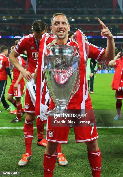 Franck Ribery of Bayern Muenchen holds the trophy after winning the UEFA Champions League final match against Borussia Dortmund at Wembley Stadium on...