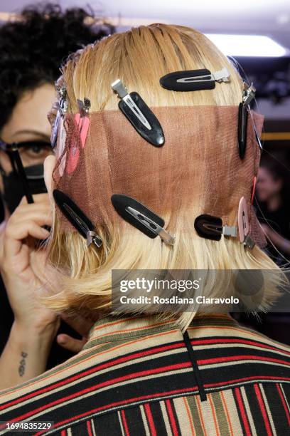 Model backstage, hair detail, ahead of the Tom Ford fashion show during the Milan Fashion Week Womenswear Spring/Summer 2024 on September 21, 2023 in...