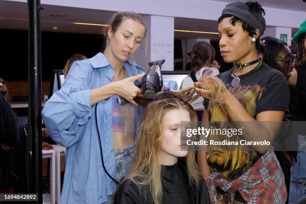 Model and hairdressers backstage ahead of the Tom Ford fashion show during the Milan Fashion Week Womenswear Spring/Summer 2024 on September 21, 2023...