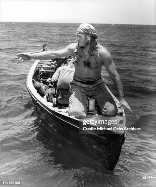 Steve McQueen escapes from French Guiana in a boat in a scene from the film 'Papillon', 1973.