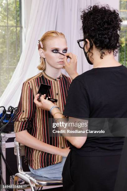 Make up artist and model Tess Breeden backstage ahead of the Tom Ford fashion show during the Milan Fashion Week Womenswear Spring/Summer 2024 on...