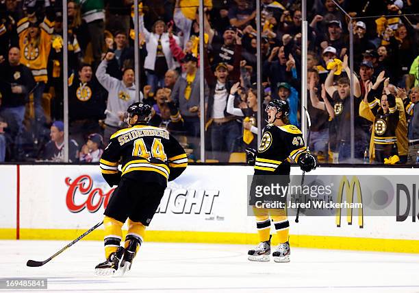 Torey Krug of the Boston Bruins celebrates a second period goal against the New York Rangers during Game Five of the Eastern Conference Semifinals of...